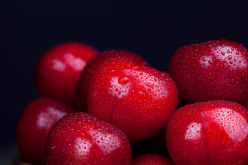 harvested ripe sweet cherries of red color
