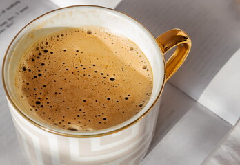 Close-up,a cup of fragrant coffee with bubbles