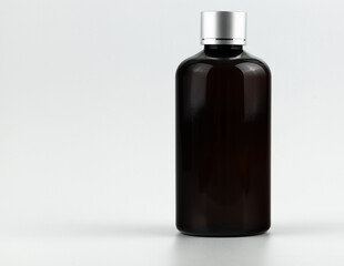 black glass bottle flacon isolated for your text and design. unbranded black glass bottle flacon...