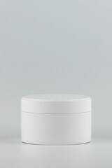 Skincare and cosmetology branding identity template for text and design. Unbranded white plastic jar for cosmetics products vertical mockup