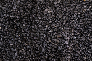 Pebbles texture background, dark wet pebble