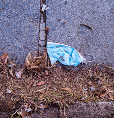 An old masarilla lying on the ground. face mask against covid