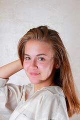 A young girl in a good mood in the summer.