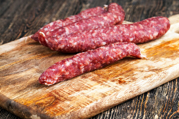 sliced sausage of dried meat with bacon