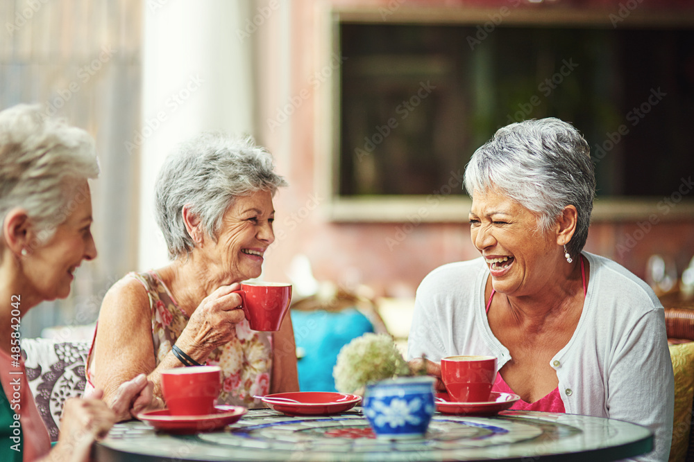 Poster Lifelong friends catching up over coffee. Cropped shot of a group of senior female friends enjoying a lunch date.