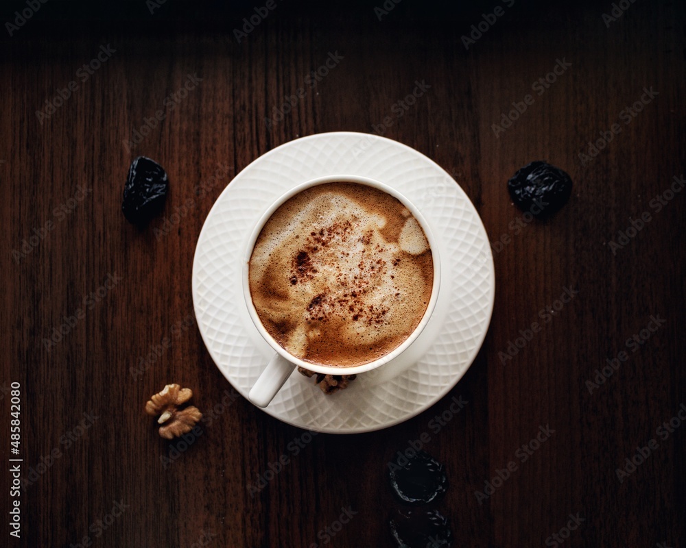 Wall mural cup of coffee on wood table