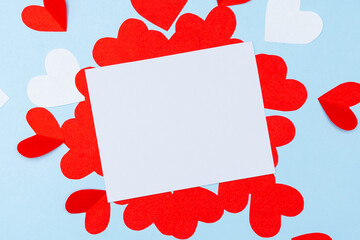 Valentine's Day. Gifts, hearts on blue background. Concept of love and affection. Holiday card.