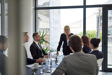 Ironing out the details. Shot of corporate businesspeople meeting in the boardroom.