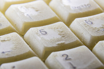 Numeric keys on a dirty computer keyboard, close-up.