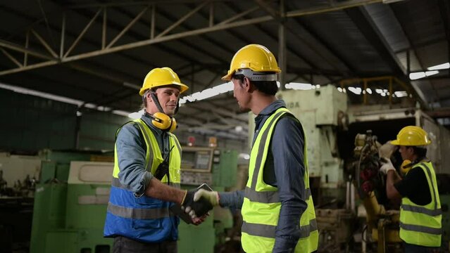 The foreign chief engineers teach and advise Asian technicians. About repairing old machinery to return to normal use