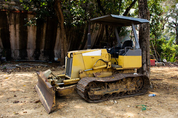 Old broken tractor machinery stop waiting thai technician people fix and repair on land...