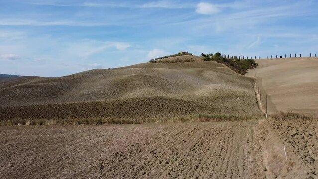 Famous Gladiator cypress road and farmhouse in Val d'Orcia, Pienza Tuscany aerial view, Italy
