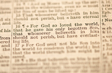 Close-up of John 3:16 (KJV), text with a shallow depth of field highlighting key words