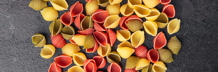 pasta conchiglie raw colored mix  meal food snack on the table copy space food background