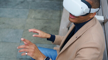 Business man using VR headset outdoors