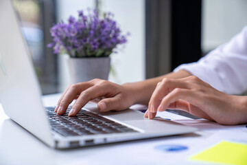 financial business woman calculating corporate income tax data and analyze financial stock charts that are in good shape with growth and progress. financial investment and accounting analysis