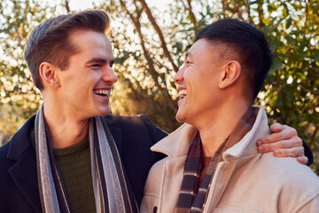 Fototapeta premium Loving Same Sex Male Couple On Walk In Countryside Together