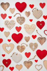 Valentine's Day composition made of different hearts on white background