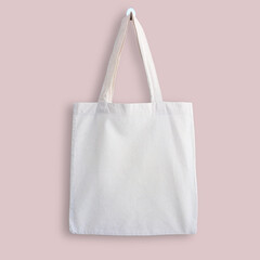 White blank cotton eco tote bag, design mockup. Shopping bag hanging on wall - 485850818