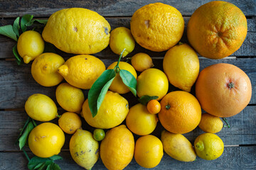 Fresh lemons and oranges
Fresh lemons and oranges on old wood. Close-up top view.