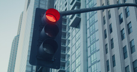 Traffic light change color on crossroad big city. Streetlight on road closeup