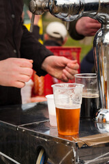 Professional at work - pouring craft draft beer on the food festival in Serbia