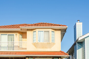 The top of the house or apartment building with nice window.