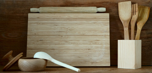 natural composition on the kitchen interior with  cutting board and kitchen cutlery in wood  home...