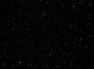 Dark glitter background. light in black background. Dust in the space. real dust particles or...