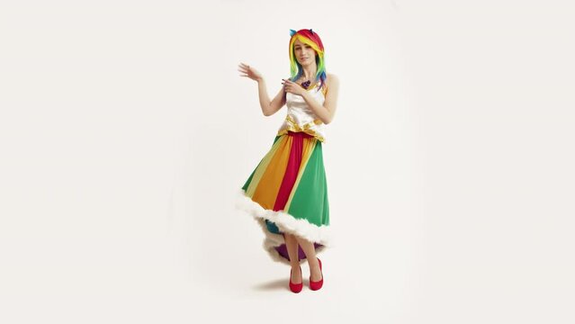 European Woman Cosplayer Dancing Rainbow Dash White Background Full Studio Shot. High quality 4k footage