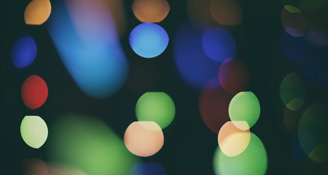 Abstract bokeh background. Christmas and New Year feast bokeh background with copyspace. Festive lights bokeh background. Glitter vintage lights background with lights defocused