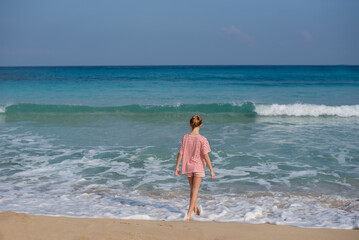 girl walking on the beach