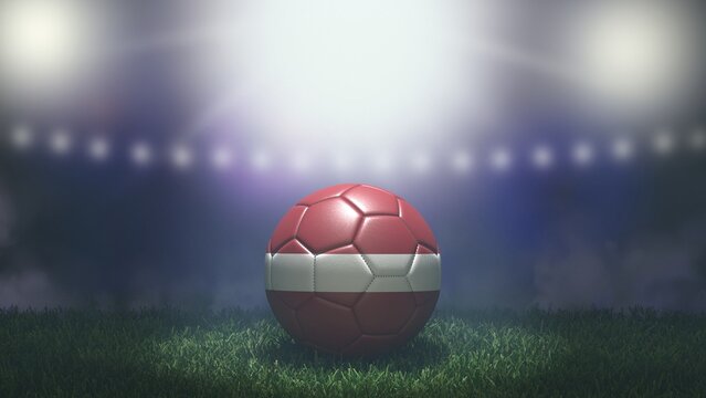 Soccer ball in flag colors on a bright blurred stadium background. Latvia. 3D image