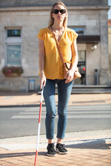 blind woman crossing the street
