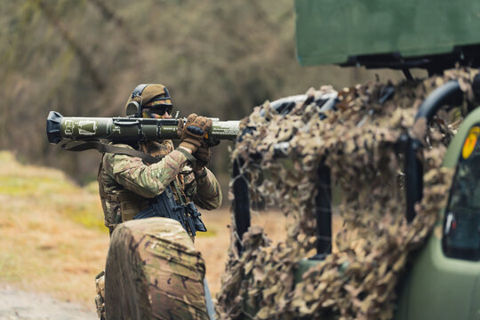 Bazooka loading behind disguise army camouflaged truck . High quality photo
