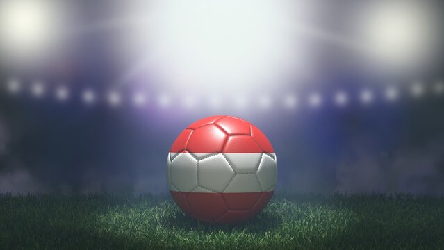 Soccer ball in flag colors on a bright blurred stadium background. Austria. 3D image