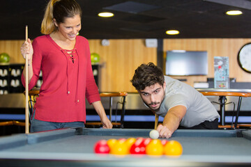 Fototapeta premium beautiful couple dating and playing snooker