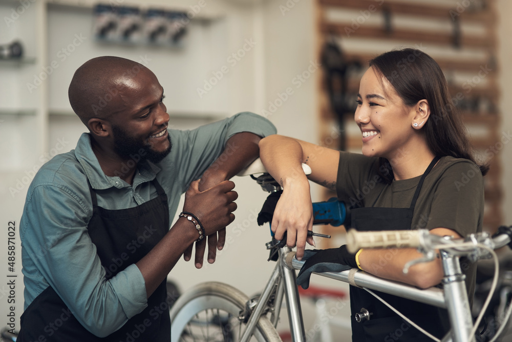 Aufkleber i fixed it faster this time. shot of two young business owners standing together in their bicycle sh