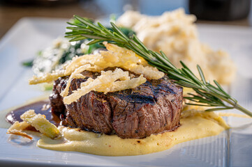 Filet with Spinach and Mashed Potato garnished with Fried Onions and Rosemary