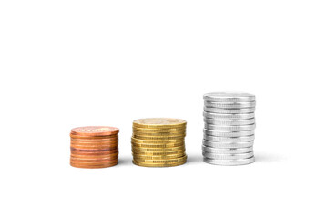 Coins stacked on a white background. Money saving concept.
