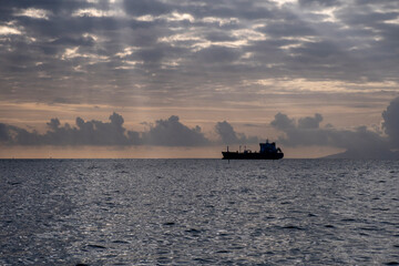 cargo ship at sunset