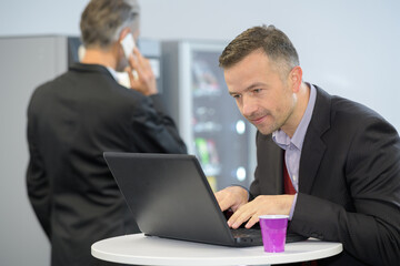 businessman working while having a coffee break