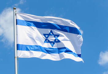 Israel national flag on a background of blue sky