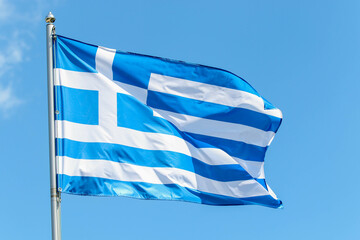Obraz premium Greece national flag on blue sky background