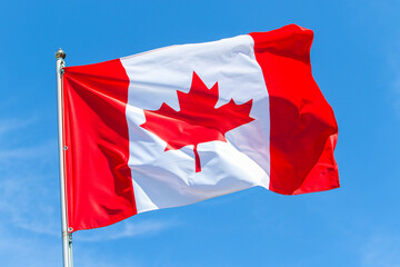Canada national flag on blue sky background