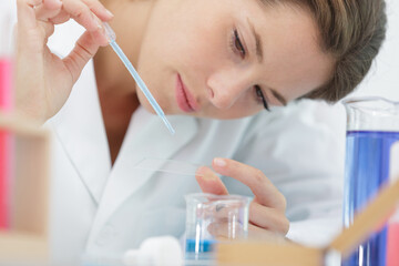 female medical laboratory technologist working in laboratory room
