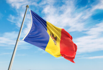 3d rendering Andorra flag waving in the wind on flagpole. Perspective wiev Andorra flag waving a blue cloudy sky