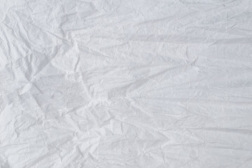 Crumpled white paper background.