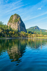 Beacon Rock and Hamilton Mountain reflected in the waters of the Columbia River at Beacon Rock State Park, Washington, USA