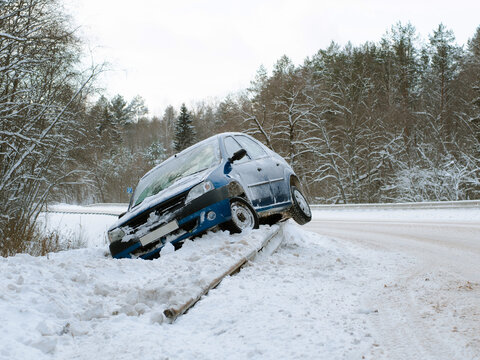 Abandoned Car On The Side Of The Road After A Traffic Accident. Symbolizes Hazardous Conditions In Winter With Ice, Snow And Jerk.